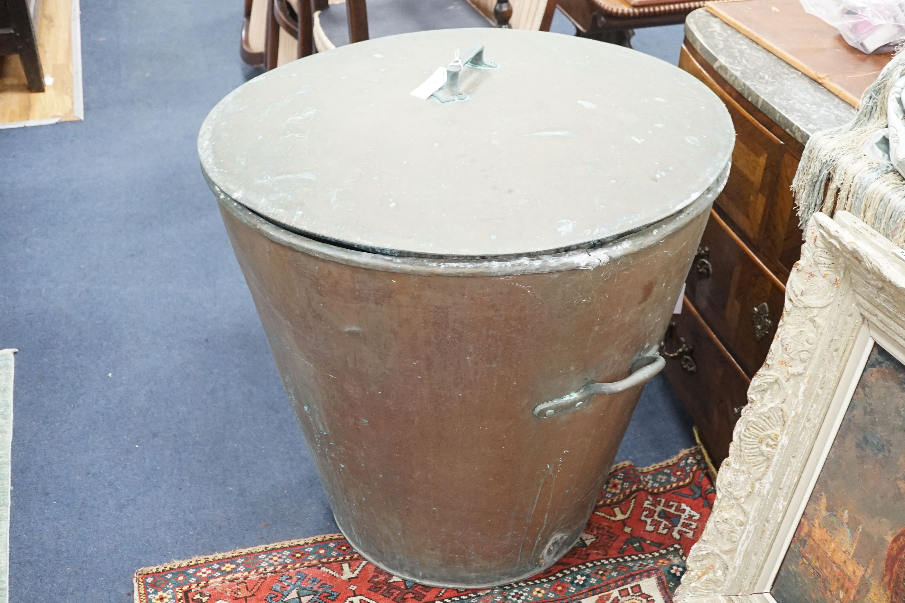 A large Victorian lidded copper vessel of tapering circular form, diameter 84cm, height 84cm